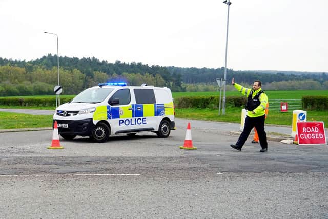 Police seal off the road in Pinxton where the remains were found.