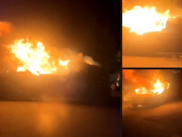Man finds a car engulfed in flames rolling backwards down street.