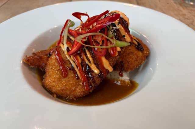 Chicken katsu curry at Hotel Football, where the pub-style food comes with a side helping of football atmosphere.
