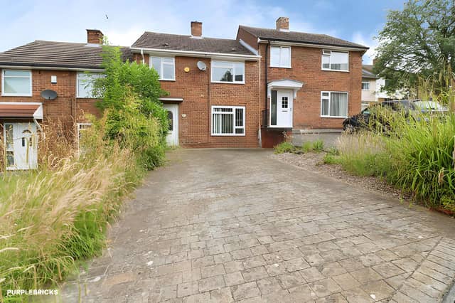 The New Street frontage offers off-road parking and leads into a three-bedroom terraced home offered with no onward chain