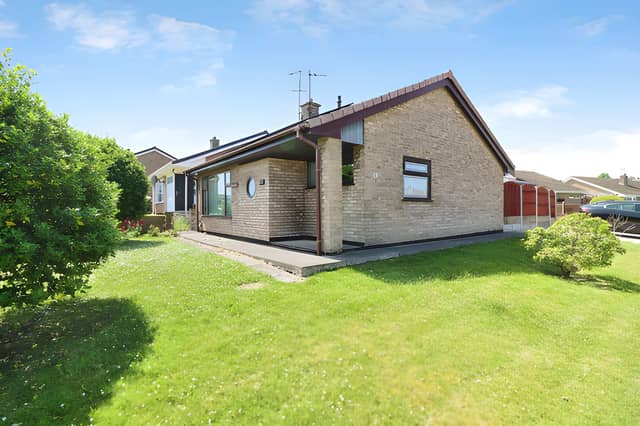 The Lodge Walk frontage sits within a quiet residential setting, with a private driveway providing off-road parking