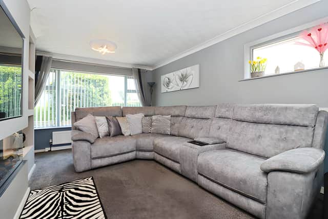 The generous lounge provides the main reception space, with room to relax and entertain within the single-level layout
