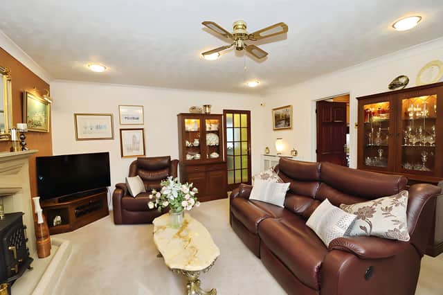 A stone feature fireplace gives the bright lounge a welcoming focal point