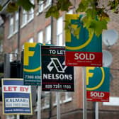 To let, for sale and sold signs outside a property