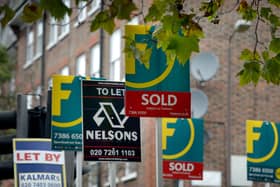 To let, for sale and sold signs outside a property