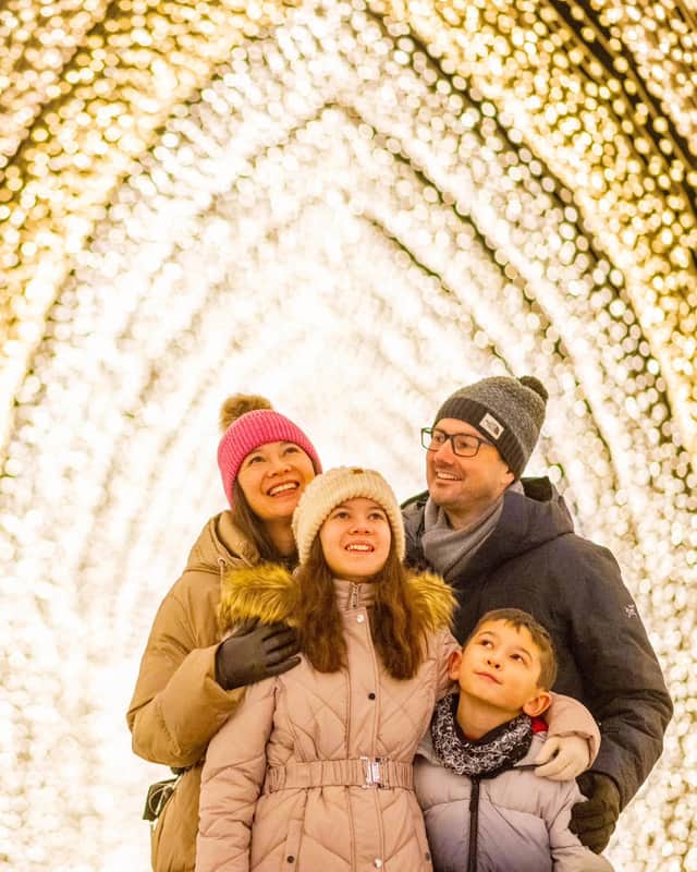 A family enjoys the sparkling Christmas Cathedral – a returning favourite at Christmas at Belton 2026