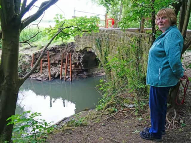 This old puddle bridge at Staveley was demolished in 2024. Karen Day, pictured, said  that it was used by children living in Woodthorpe to get to school.