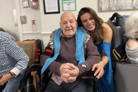 The celebrations began with a surprise performance from Julia Bisby, a belly dancer from ‘A Taste of Cairo’ and one of Colin’s favourite live entertainers. Performing a variety of styles,
from Egyptian Raqs Sharqi to Turkish Oryantal, Julia soon had residents and members of the
care team joining in with hand fans and coin scarves.