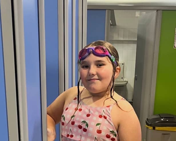 Delilah Carline-Nickson, nine, is set to swim 100 pool lengths to help her sister.
