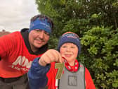 Seven-year-old Oscar Wilson of Ilkeston with his dad Nikki.