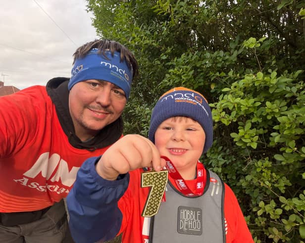 Seven-year-old Oscar Wilson of Ilkeston with his dad Nikki.