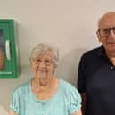 Margaret Bowen, with Tony Carter, Dicky Tickers chairman and the defibrillator