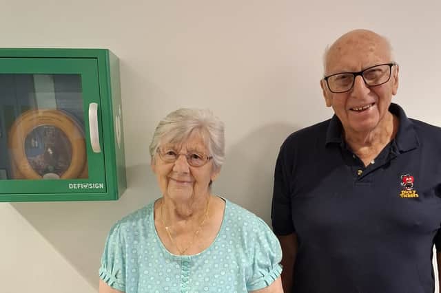 Margaret Bowen, with Tony Carter, Dicky Tickers chairman and the defibrillator