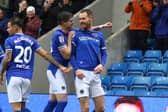 Tom Naylor celebrates his goal for Chesterfield against Crewe