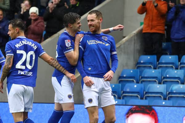 Tom Naylor celebrates his goal for Chesterfield against Crewe