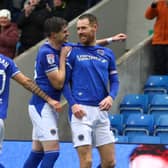 Tom Naylor celebrates his goal for Chesterfield against Crewe