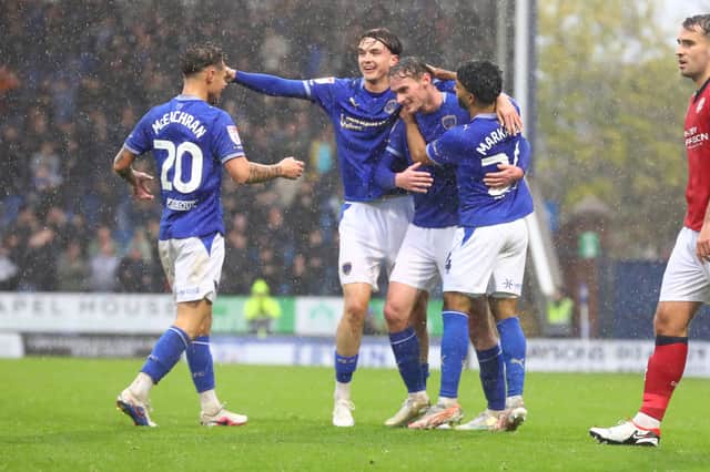 Group celebration after Liam Mandeville makes it 5-0 against Crewe