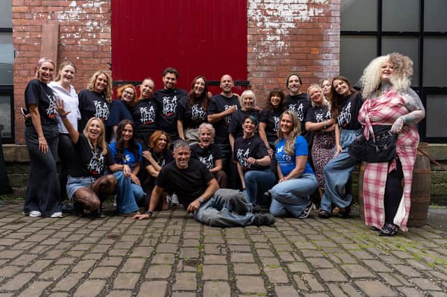 Tracey Ann Smith, kneeling left on front row, with the hair stylists who responded to her call to support the makeover event for the charity DEBRA.