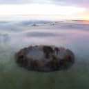 A misty dawn breaks over Minninglow in the Peak District