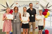 Superheroes Evie, Breadsall Hilltop Primary and Nursery School, Lucia, Lawn Primary School, and Finaly from Breadsall Hilltop Primary and Nursery school with Rebecca Meredith CEO Transform Trust and Luke Wilkins, Governor at Lawn Primary school