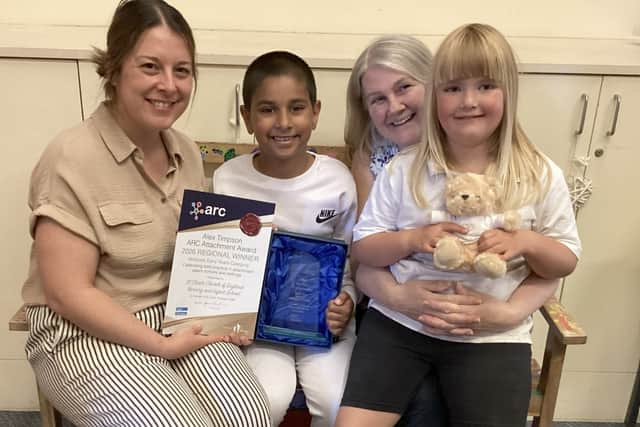 Katie Gilsenan (SENDCo and Inclusion Leader) and Nicky Kay (Welfare Officer) with two pupils and the award.