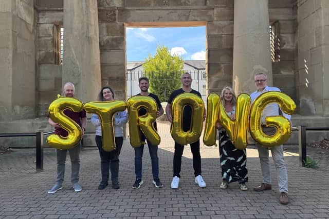 A team from Nine Dots Development celebrating their ‘Strong in all areas’ judgement from Ofsted, pictured outside their Derby offices on Vernongate: Rob Nuttall, Information and Guidance Officer; Jess Walsh, Training Co-ordinator; James Davison, Co-founde