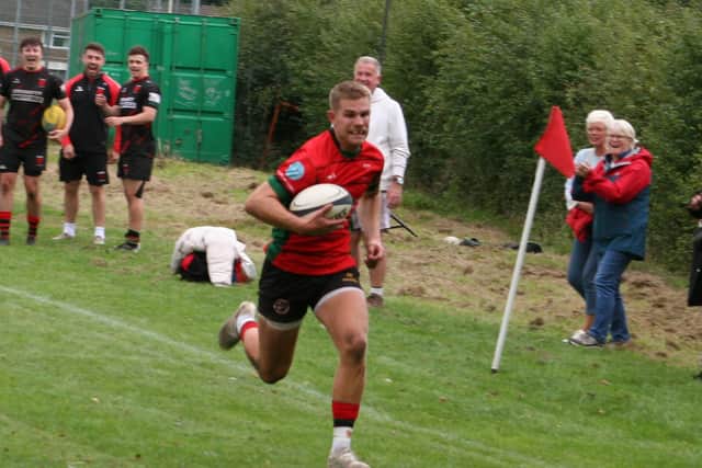 Joel Gunn sprinting through to score for the Stags