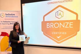 Assistant head teacher Theresa Luca, collecting the broze award for inclusive atttendance 