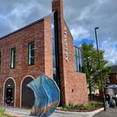 The Staveley 21 project transformed the market place with new paving, lighting, planting, a play space, and a pavilion building
