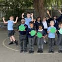 Children at St Laurence CofE Primary School celebrating their successful Ofsted report.