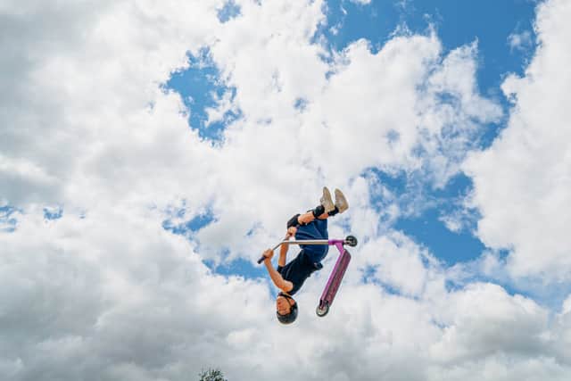 A white-knuckle stunt being performed during an Extreme Wheels Roadshow