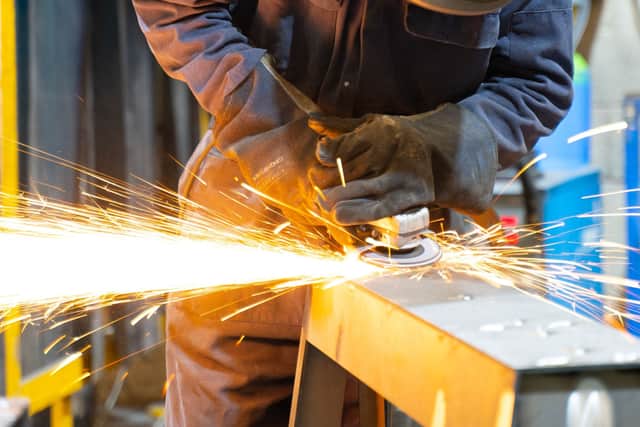An Acres employee welding