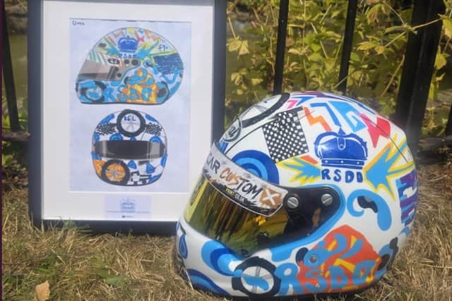 The original artwork created for Caleb McDuff and the helmet eh presented with the school as a thank you 