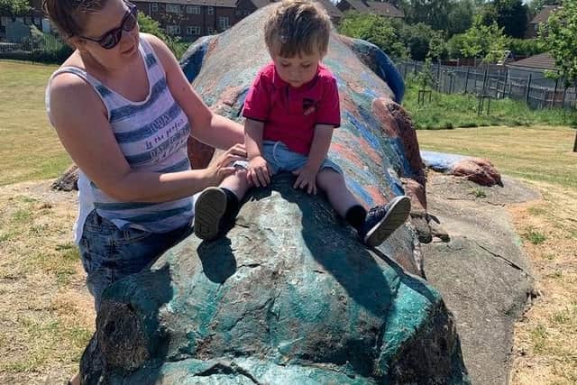 Little boy enjoys the South Normanton dinosaur