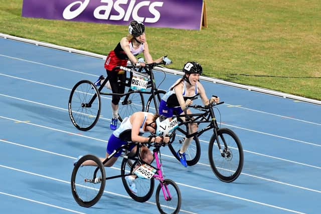 Ellie Simpson (centre) sprinting to second place in the World Para Athletics Championships. (PHOTO BY: Luc Percival Photography)