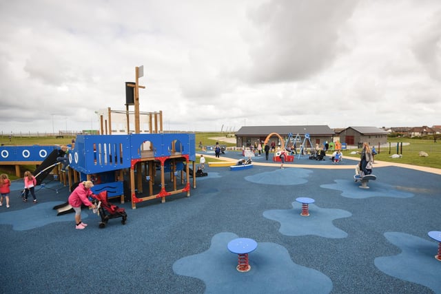 The play equipment is pirate-themed and brightly coloured. It was designed with inclusivity in mind, incorporating sensory play.