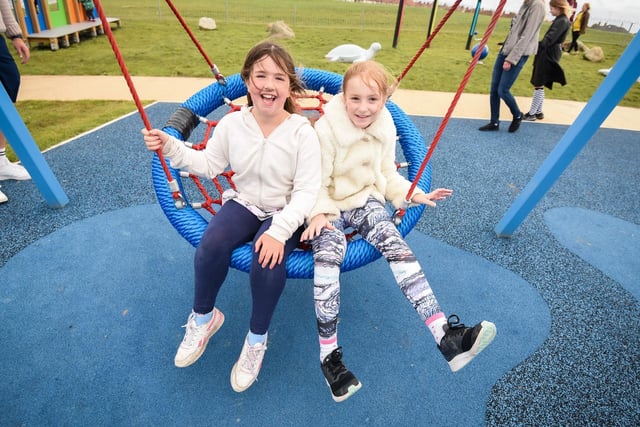 Alice Tenbey, eight, and Annabela Andrews, 10, enjoy the new pirate-themed swing.