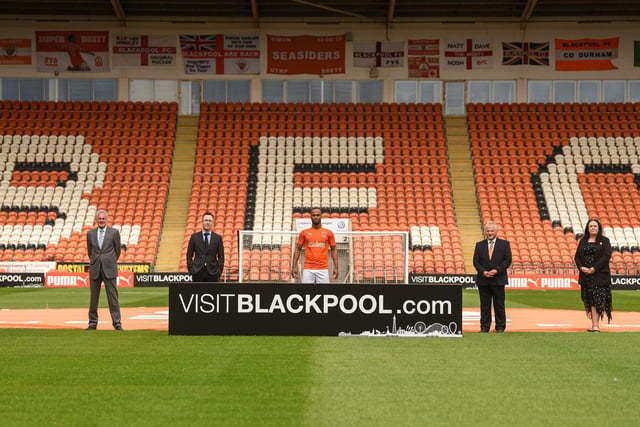 Nathan Delfouneso poses with members of Blackpool Council