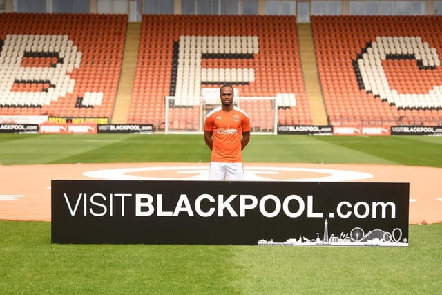 Nathan Delfouneso poses with the Visit Blackpool branding
