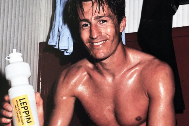 Lee Chjapman poses for the camera in the dressing room at Dean Court after his goal helped Leeds United clinch promotion back to the First Division.