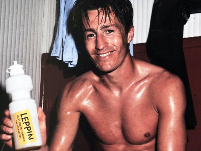 Lee Chjapman poses for the camera in the dressing room at Dean Court after his goal helped Leeds United clinch promotion back to the First Division.