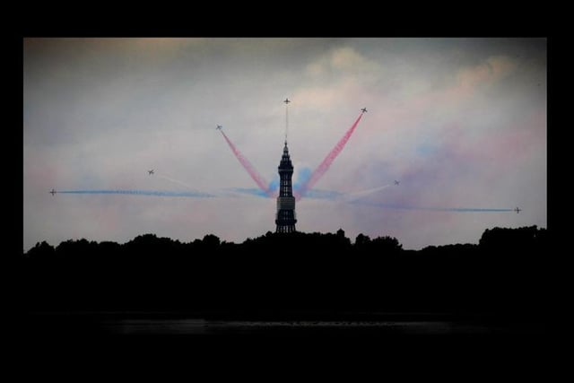 Perfect timing: The Red Arrows split in front of the Tower
