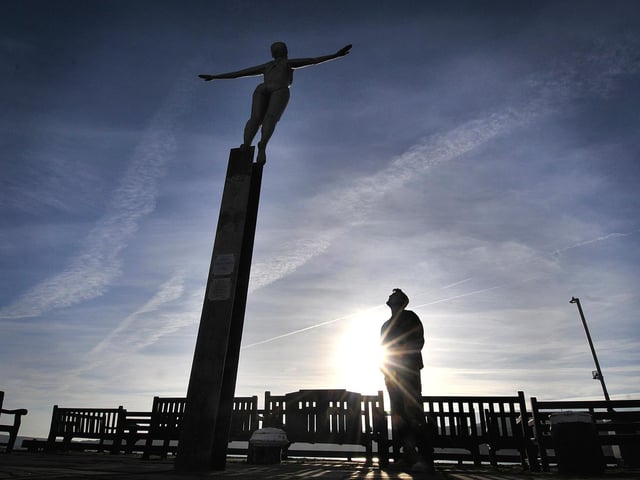 Explore Scarborough Harbour including the Diving Belle statue