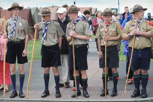 An impromptu knobbly knees contest as scouts wait to cross the road