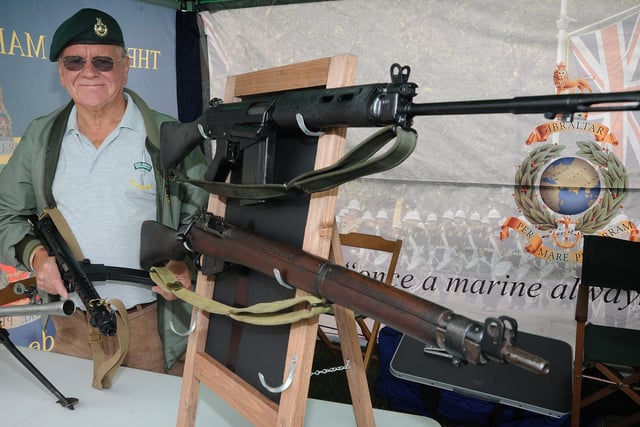 Former Marine Ray Pinkstone with some of the regiment's past weapons
