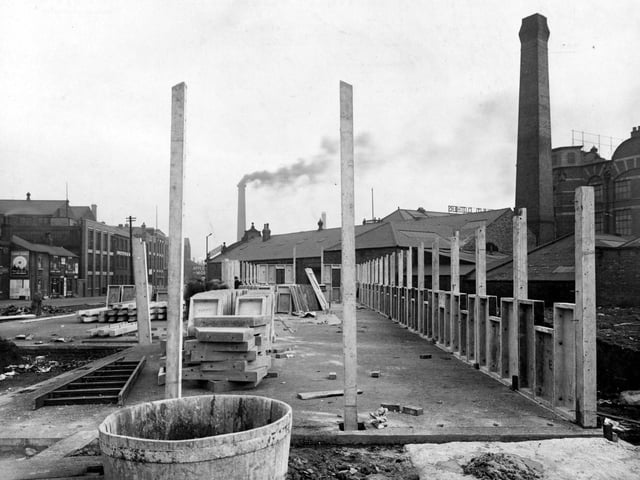 Construction of a British Restaurant on Whitehall Road at Holbeck. Wooden posts, concrete slabs and a ladder are visible.
