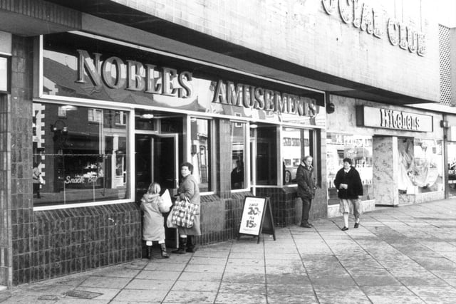 A black and white copy of a photograph of the frontage of Noble's Amusement Arcade on Carlton Street, Castleford