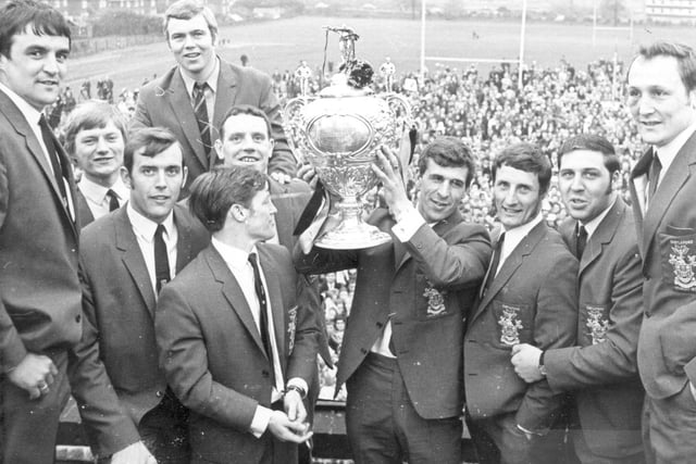 Tthe 1970 cup winners, displaying their trophy - This public gathering took place at the Castleford Boys Modern School grounds on Pontefract Road. Behind the crowds a block of Parklands Estate flats are visible.