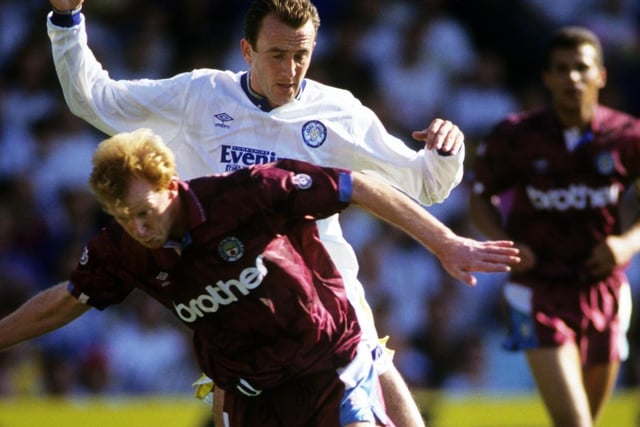 Two Gary's tussle for the ball - McAllister and Megson.