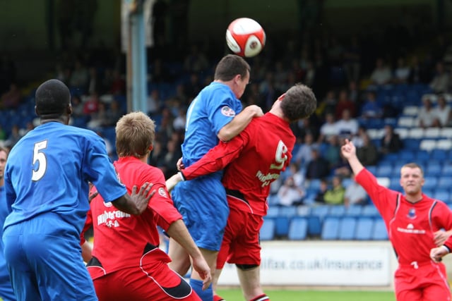 A Town player goes for a header